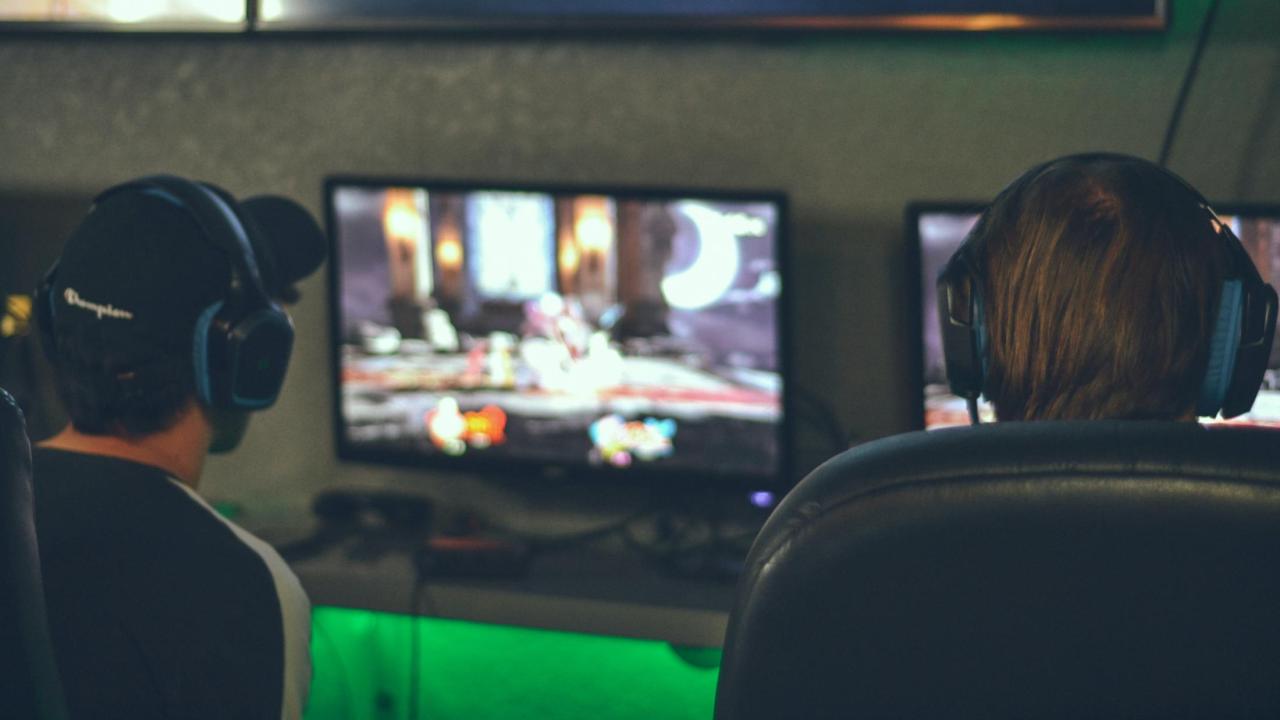 Teens playing video games image