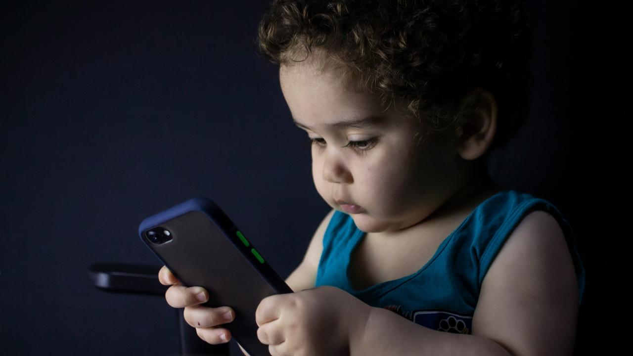 Child looking at phone