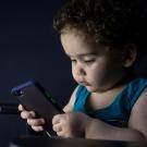 Child looking at phone
